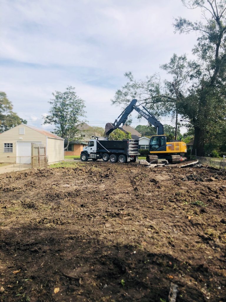 Excavator and truck – Big Easy Concrete