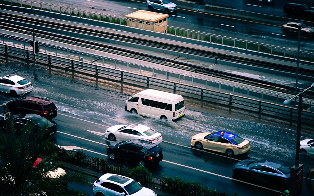 Urban street flooding after heavy rain showing the importance of functioning curb and gutter drainage systems