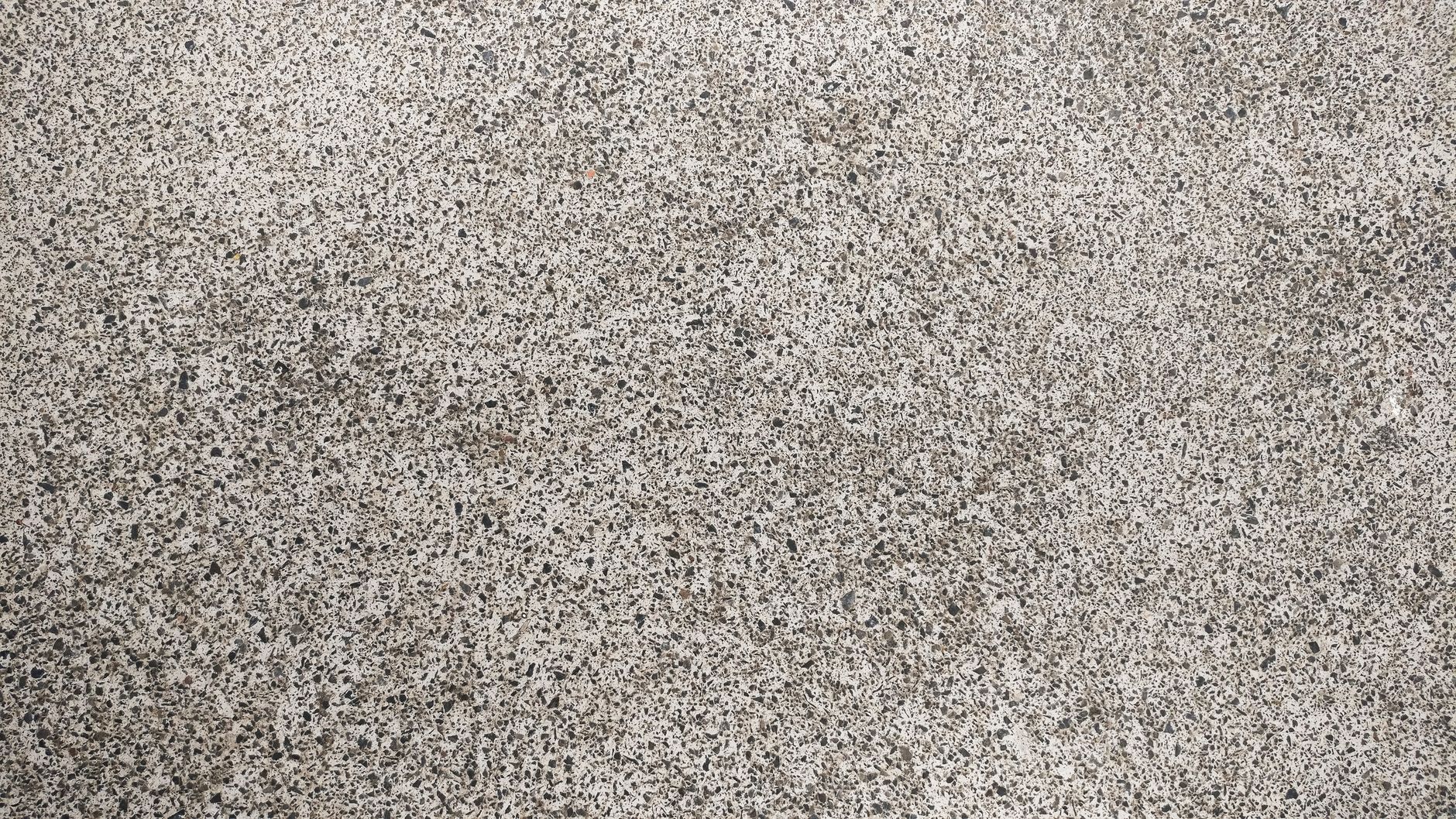 Slate-textured stamped concrete driveway surface