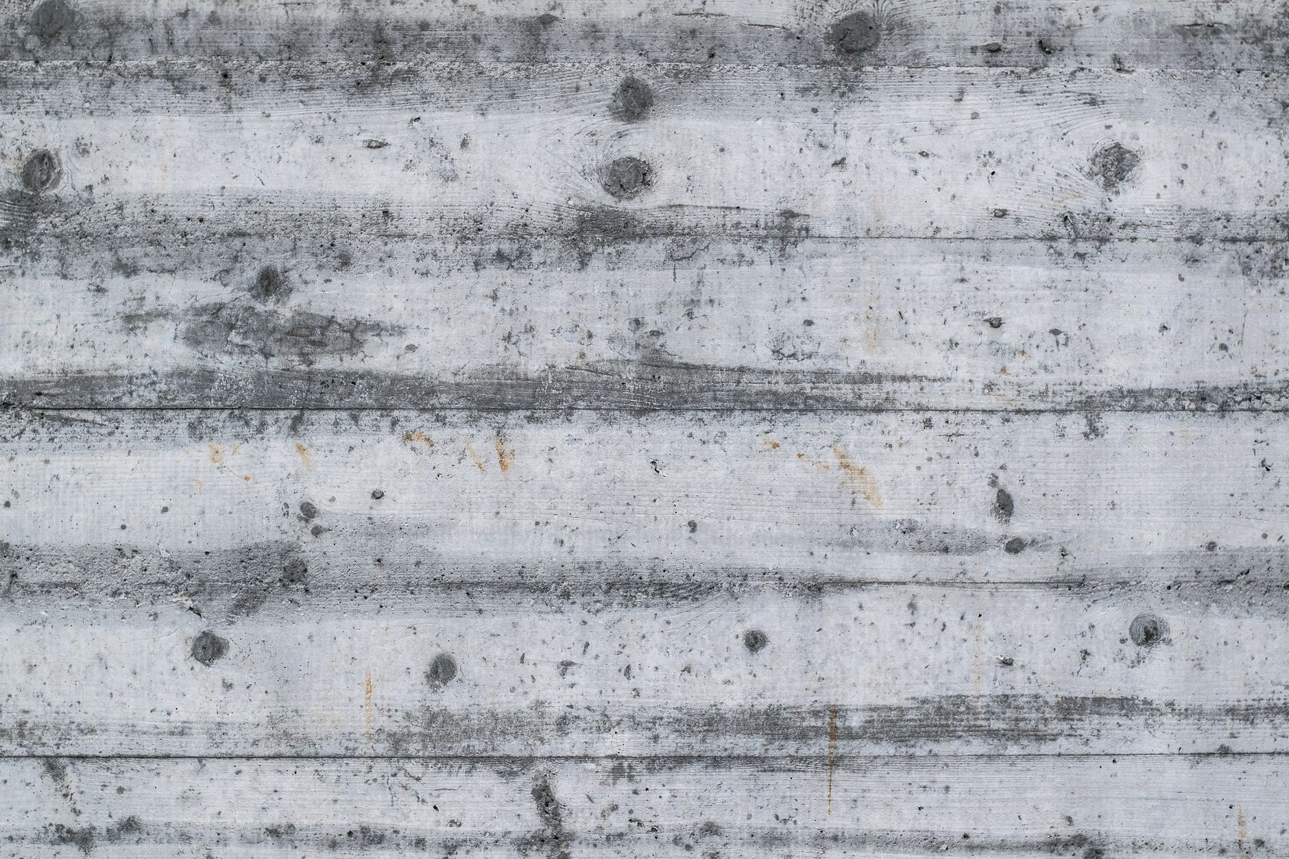 Warm-toned textured concrete surface showing color variation